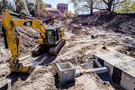 Excavator operating at urban construction site in Washington