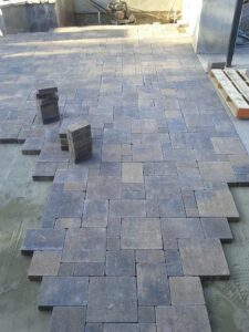 Paving stones being installed on outdoor patio