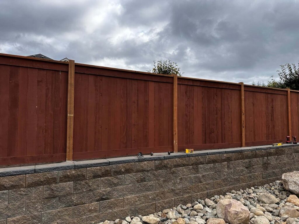 retaining wall and residential fence install job with ivans