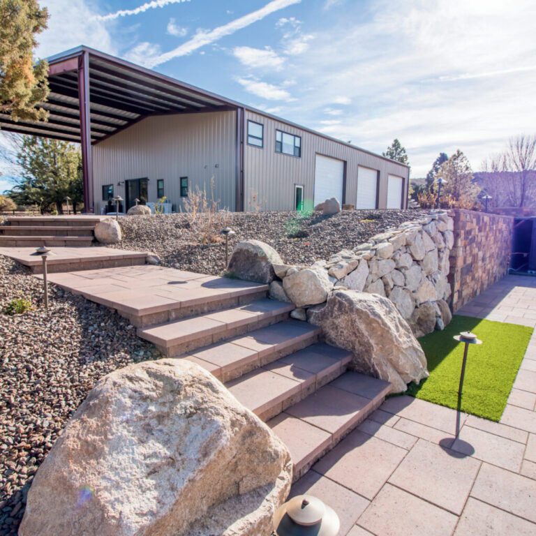 Modern metal building with stone landscaping